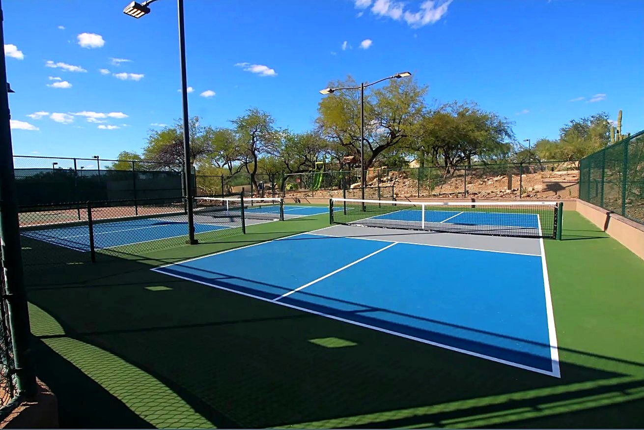 The blue community courts at McDowell Mountain Ranch — tennis and pickleball courts set in desert landscaping